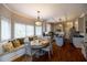 Open-concept kitchen area with banquette seating, a kitchen island, and modern appliances at 2975 Oak Hampton Way, Duluth, GA 30096