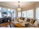 Charming breakfast nook featuring a banquette seating area, a pendant light, and plenty of windows at 2975 Oak Hampton Way, Duluth, GA 30096