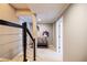 Hallway featuring modern railing and neutral paint, leading to bedrooms and living spaces at 2975 Oak Hampton Way, Duluth, GA 30096