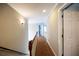 Upstairs hallway with carpet, white trim, and doorways, offering a clear view of the home's layout at 2975 Oak Hampton Way, Duluth, GA 30096