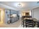 Kitchenette with gray cabinets, microwave, mini fridge, and dining area with seating at 2975 Oak Hampton Way, Duluth, GA 30096