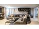Cozy living room featuring a large sectional sofa and built-in bookshelves at 2975 Oak Hampton Way, Duluth, GA 30096