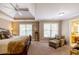 Spacious bedroom featuring trey ceiling, neutral colors, carpet, a ceiling fan and a sitting area at 2975 Oak Hampton Way, Duluth, GA 30096