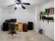 Home office featuring desk, computer, shelves, file cabinet, ceiling fan, and a house plant at 2975 Oak Hampton Way, Duluth, GA 30096