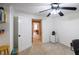 Office space or bedroom with door leading to the hallway and view of the main bedroom in the background at 2975 Oak Hampton Way, Duluth, GA 30096
