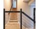 Carpeted staircase with modern railing and neutral paint, leading to the upper level at 2975 Oak Hampton Way, Duluth, GA 30096