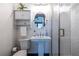Compact bathroom featuring a pedestal sink, subway tile shower, and updated fixtures at 1014 Braeburn Ln, Decatur, GA 30030