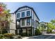 Charming two-story home with white siding, black trim, and a inviting front porch at 1014 Braeburn Ln, Decatur, GA 30030
