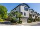 Charming townhome with white siding, black trim, and a well-maintained yard on a sunny day at 1014 Braeburn Ln, Decatur, GA 30030