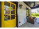 Inviting front porch with a yellow door, creating a warm and welcoming entrance at 1014 Braeburn Ln, Decatur, GA 30030