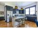 Modern kitchen with stainless steel appliances, a center island, and elegant navy cabinetry at 1014 Braeburn Ln, Decatur, GA 30030