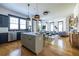 Open concept kitchen with stainless steel appliances, gray cabinets, and island blends into the adjacent living spaces at 1014 Braeburn Ln, Decatur, GA 30030