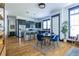 Modern eat-in kitchen featuring stainless appliances, a center island with seating and adjacent dining space at 1014 Braeburn Ln, Decatur, GA 30030