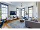 Bright living room featuring hardwood floors, large windows, and a comfortable seating arrangement at 1014 Braeburn Ln, Decatur, GA 30030