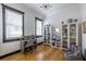 Bright office with hardwood floors, large windows, a desk, and ample storage and seating at 1014 Braeburn Ln, Decatur, GA 30030