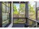 Charming outdoor porch with a view of the surrounding greenery and neighborhood at 1014 Braeburn Ln, Decatur, GA 30030