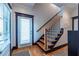 Staircase with wooden treads and a door to the exterior, perfect for accessing outdoor spaces at 1014 Braeburn Ln, Decatur, GA 30030