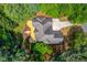Aerial view showcasing lush greenery, a wooden deck, and home, ideal for outdoor enjoyment at 12340 Preserve Ln, Alpharetta, GA 30005