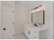 Bright bathroom with a white vanity, modern lighting, and sleek black fixtures at 12340 Preserve Ln, Alpharetta, GA 30005