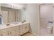 Bathroom with double sinks, a large mirror, and a separate room for the toilet at 12340 Preserve Ln, Alpharetta, GA 30005