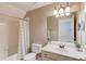 Bathroom with neutral paint, vanity, sink, and mirror. Bath and shower combination with shower curtain at 12340 Preserve Ln, Alpharetta, GA 30005