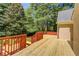 Multi-level wooden deck with wood railing, ideal for outdoor entertaining and relaxation at 12340 Preserve Ln, Alpharetta, GA 30005