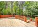 Expansive wooden deck with wood railing, perfect for entertaining and relaxation at 12340 Preserve Ln, Alpharetta, GA 30005