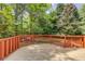 Charming deck with wood railing, offering a tranquil space with views of the lush backyard at 12340 Preserve Ln, Alpharetta, GA 30005
