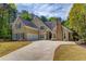 Charming two-story home with a two car garage, beautiful stonework, and professionally landscaped yard at 12340 Preserve Ln, Alpharetta, GA 30005