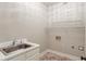 Practical laundry area with utility sink and shelving at 12340 Preserve Ln, Alpharetta, GA 30005