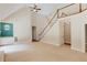 Bright living room with vaulted ceilings, stairs to upper level and a built in at 12340 Preserve Ln, Alpharetta, GA 30005