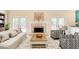 Cozy living room features a fireplace, French doors, and stylish furniture at 12340 Preserve Ln, Alpharetta, GA 30005
