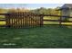 Fenced backyard with a well-maintained lawn, ideal for families and pet owners alike at 1424 Belmont Rd, Villa Rica, GA 30180