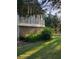 The home's back exterior features wood siding, a screened in porch, and a backyard at 1424 Belmont Rd, Villa Rica, GA 30180