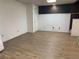 Unfinished basement space features durable floors, painted walls, and a door to the outside at 1424 Belmont Rd, Villa Rica, GA 30180