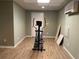 This basement area has durable floors, a door to the outside, and a mini AC unit for comfort at 1424 Belmont Rd, Villa Rica, GA 30180