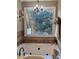 Soaking tub is positioned to provide an exterior view from a window over the tub at 1424 Belmont Rd, Villa Rica, GA 30180