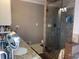 Updated bathroom with granite counters, tile flooring, and a glass-enclosed shower at 1424 Belmont Rd, Villa Rica, GA 30180