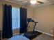 Bedroom featuring a treadmill and a window, ideal for a home gym or workout space at 1424 Belmont Rd, Villa Rica, GA 30180
