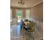 Inviting dining area with a dark-stained tabletop, bench seating, and tiled floor at 1424 Belmont Rd, Villa Rica, GA 30180