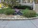 Landscaped yard with flowerbeds, small pond, and stone walkway to steps at 1424 Belmont Rd, Villa Rica, GA 30180
