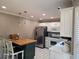 Well-lit kitchen with white cabinets, stainless steel appliances, and a kitchen island at 1424 Belmont Rd, Villa Rica, GA 30180