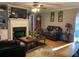 Cozy living room features hardwood floors, fireplace, and comfortable leather seating at 1424 Belmont Rd, Villa Rica, GA 30180