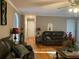 Warm living room featuring hardwood floors, classic furniture, and neutral wall colors at 1424 Belmont Rd, Villa Rica, GA 30180