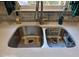 Modern stainless steel kitchen sink with white countertops and stylish decor at 1424 Belmont Rd, Villa Rica, GA 30180