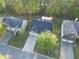 Aerial view of a neighborhood with well-maintained lawns and mature trees surrounding the houses at 210 Arbor Creek Dr, Dallas, GA 30157