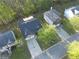 Birds-eye view of a home with an attached two-car garage in a neighborhood with tree-lined streets at 210 Arbor Creek Dr, Dallas, GA 30157