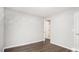 The bedroom features luxury vinyl flooring and a doorway that leads to another room at 210 Arbor Creek Dr, Dallas, GA 30157