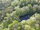 Mature trees surround a small creek that runs through the back side of the property at 210 Arbor Creek Dr, Dallas, GA 30157