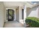 Close-up of a home's front entrance, featuring a black door with glass panes at 210 Arbor Creek Dr, Dallas, GA 30157